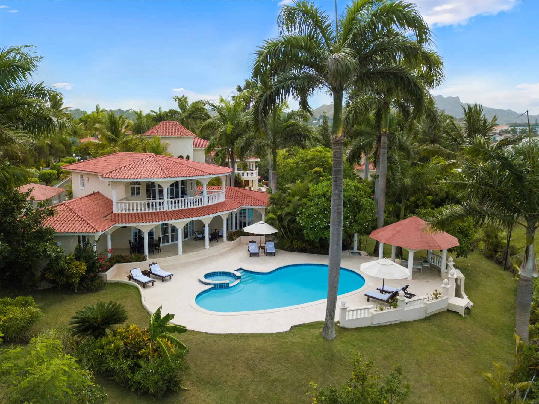 Aerial view of a Crown Villa with a private swimming pool and tropical gardens