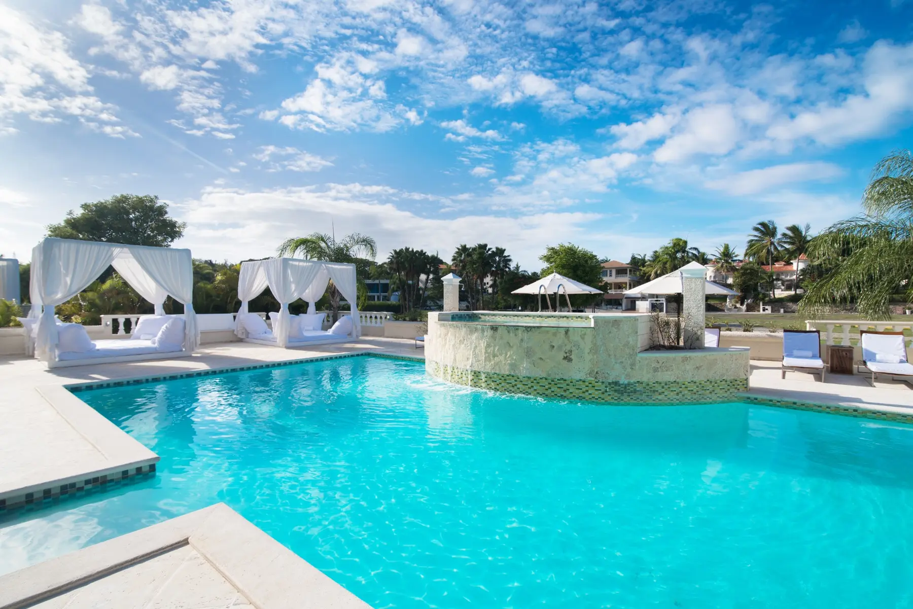 Large swimming pool and cabanas at the Crown Villas